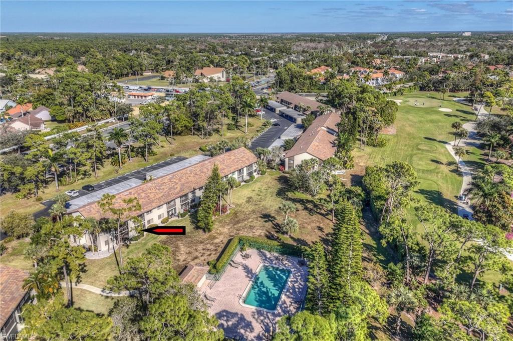 5825 Rattlesnake Hammock Road, Unit 107 Naples, FL 34113 - Photo 36 of 38 an aerial view of residential house with outdoor space and trees