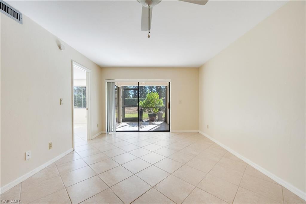 5825 Rattlesnake Hammock Road, Unit 107 Naples, FL 34113 - Photo 7 of 38 a view of an empty room with a window