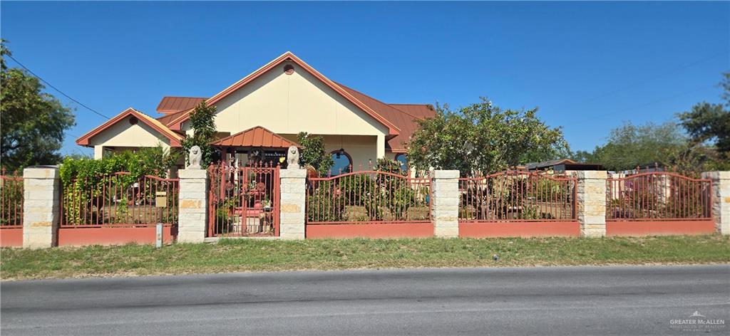 322 North Charco Blanco Road Rio Grande City, TX 78582 - Photo 1 of 28 a front view of a house with garden