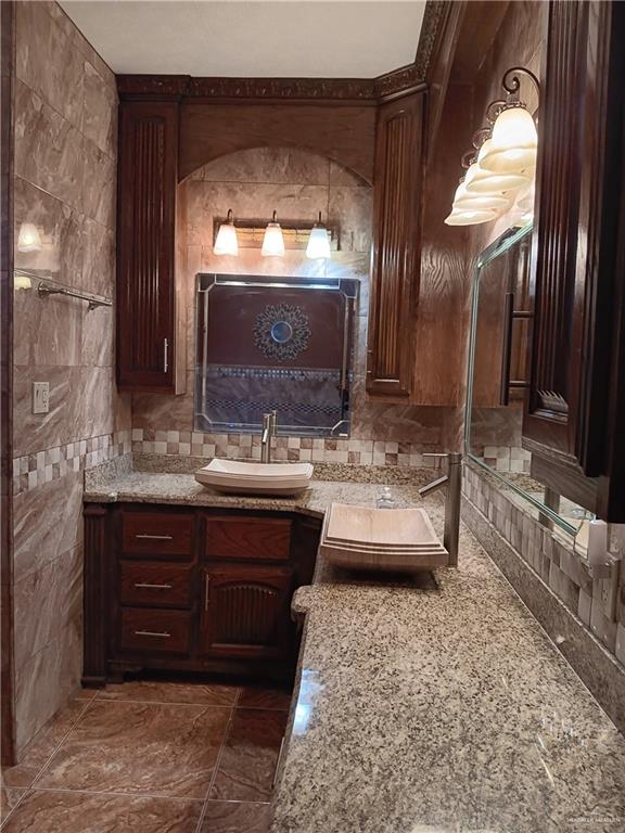 322 North Charco Blanco Road Rio Grande City, TX 78582 - Photo 15 of 28 a bathroom with a sink and a large mirror