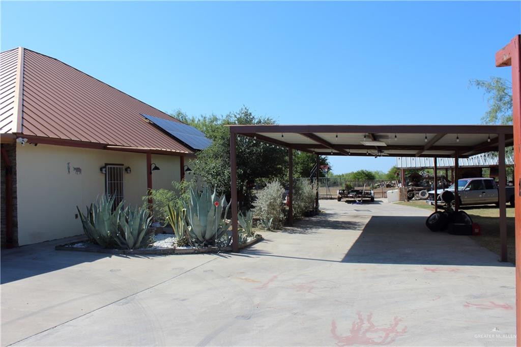 322 North Charco Blanco Road Rio Grande City, TX 78582 - Photo 23 of 28 a view of a patio with table and chairs under an umbrella