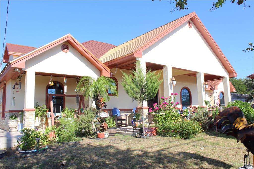 322 North Charco Blanco Road Rio Grande City, TX 78582 - Photo 5 of 28 a front view of a house with a yard