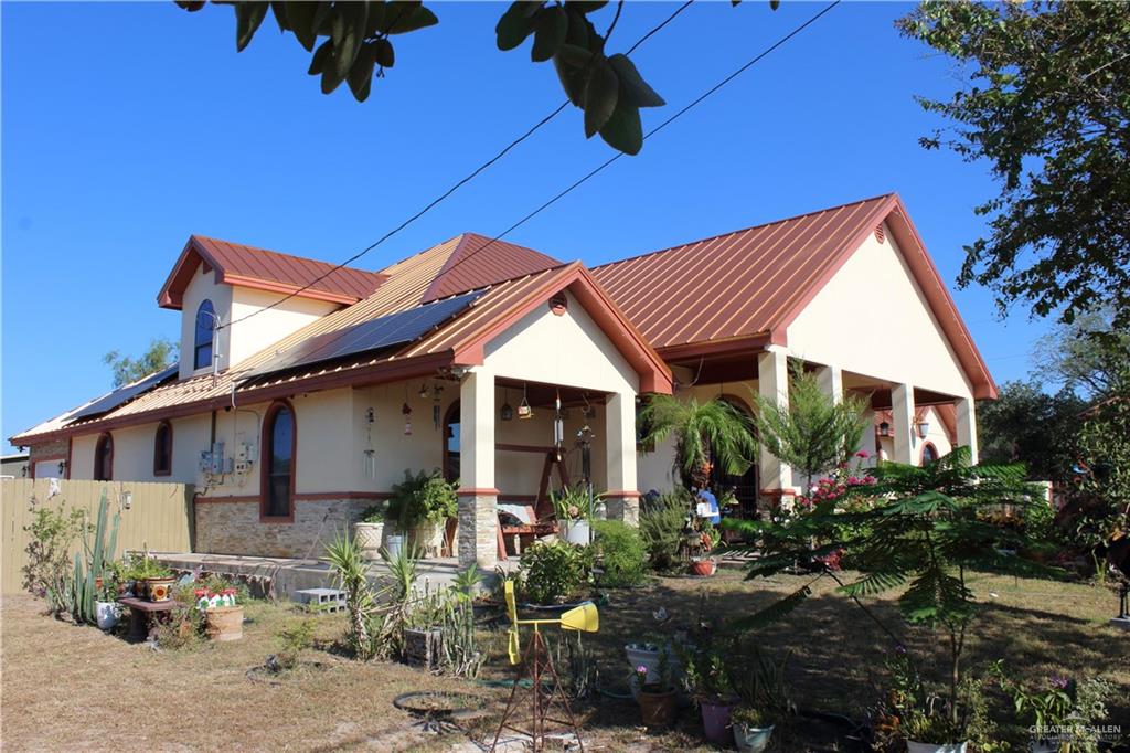 322 North Charco Blanco Road Rio Grande City, TX 78582 - Photo 6 of 28 a front view of a house with garden