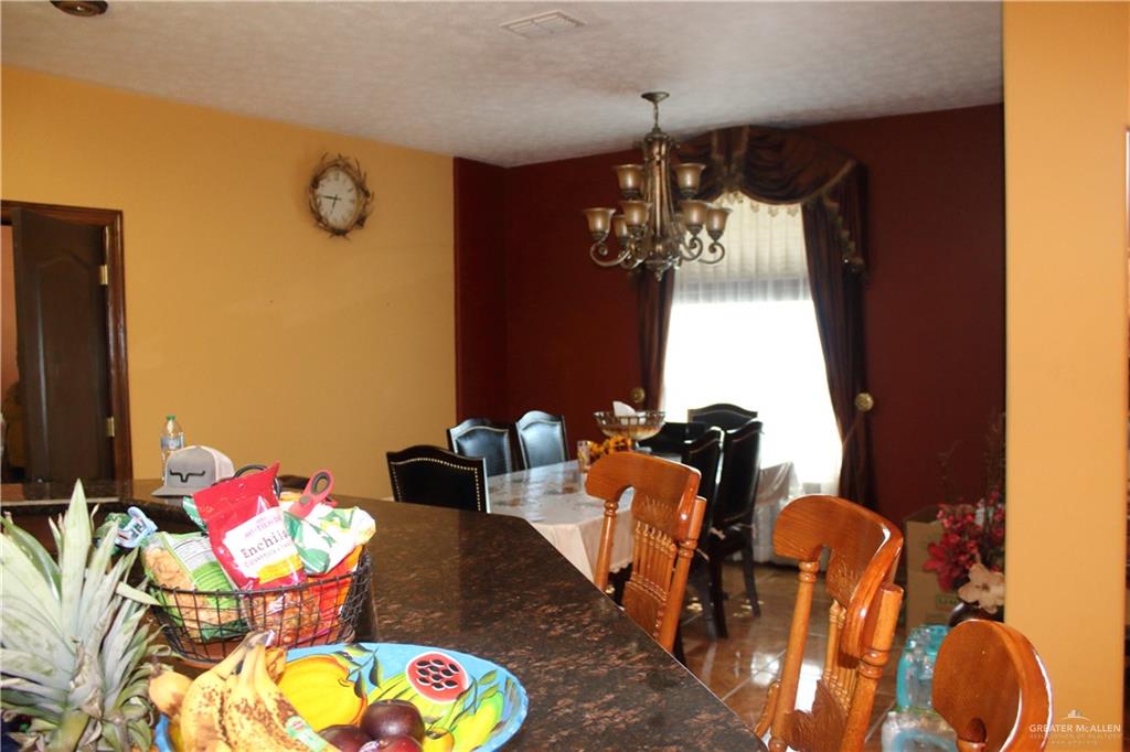 322 North Charco Blanco Road Rio Grande City, TX 78582 - Photo 9 of 28 a bathroom with a sink mirror and tub
