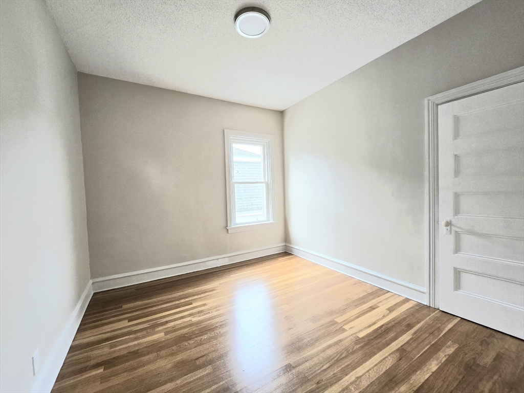 24 Ash Street, Unit 3 Fall River, MA 02724 - Photo 12 of 15 a view of an empty room and window
