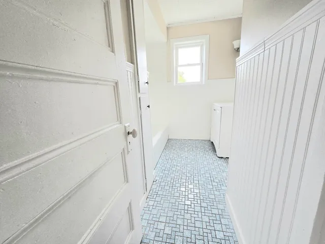 a view of a bathroom from a hallway