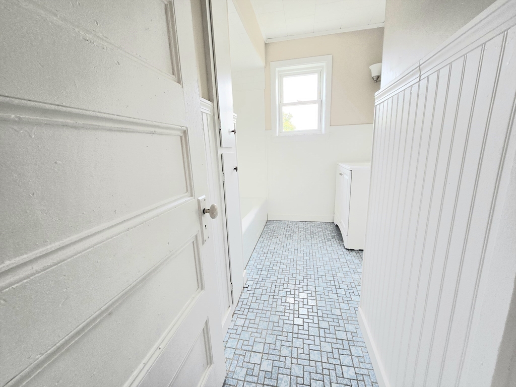 24 Ash Street, Unit 3 Fall River, MA 02724 - Photo 13 of 15 a view of a bathroom from a hallway