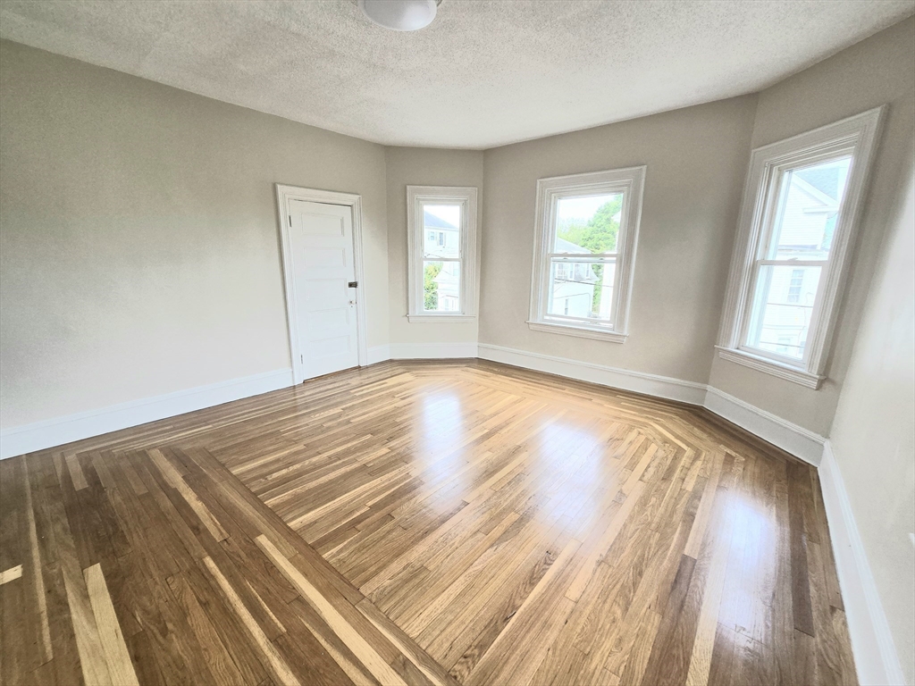 24 Ash Street, Unit 3 Fall River, MA 02724 - Photo 7 of 15 a view of an empty room and window