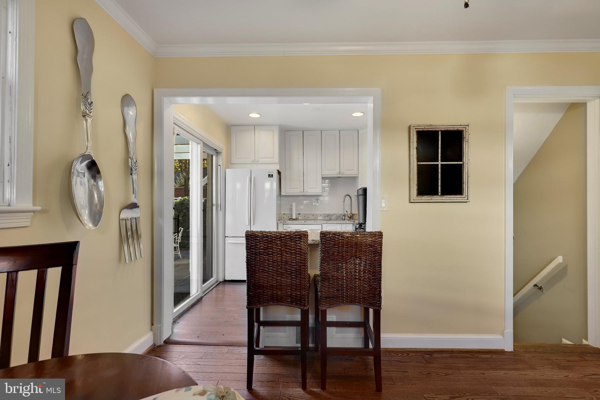 9515 Riley Road Silver Spring, MD 20910 - Photo 12 of 43 a dining room with furniture and wooden floor