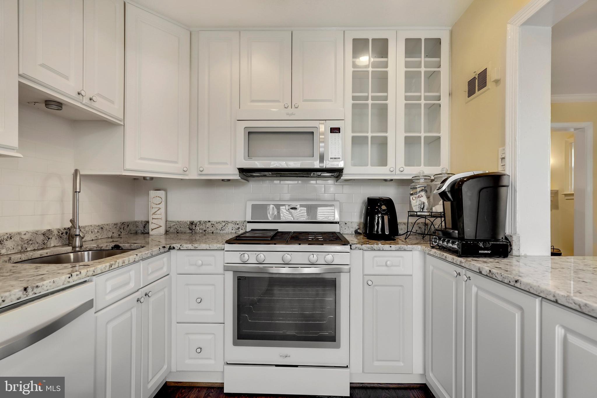 9515 Riley Road Silver Spring, MD 20910 - Photo 14 of 43 a kitchen with cabinets appliances a sink and a counter top space