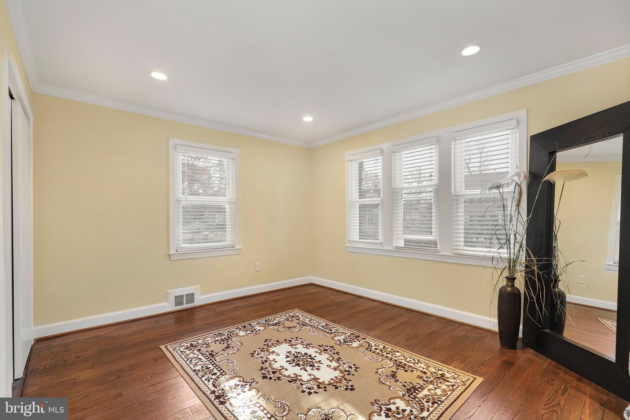 9515 Riley Road Silver Spring, MD 20910 - Photo 17 of 43 a big room with wooden floor and a window