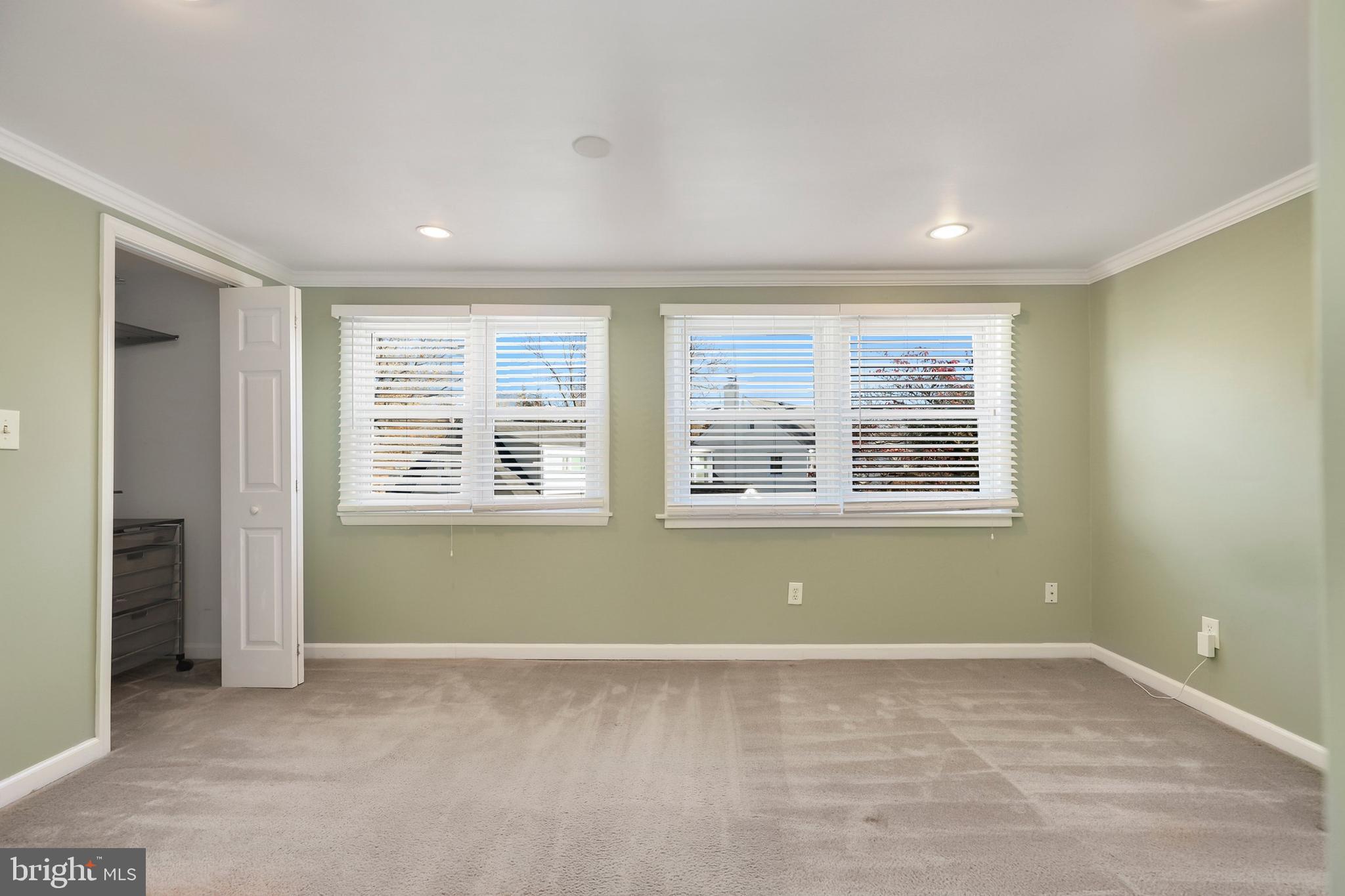 9515 Riley Road Silver Spring, MD 20910 - Photo 23 of 43 an empty room with a window and a kitchen