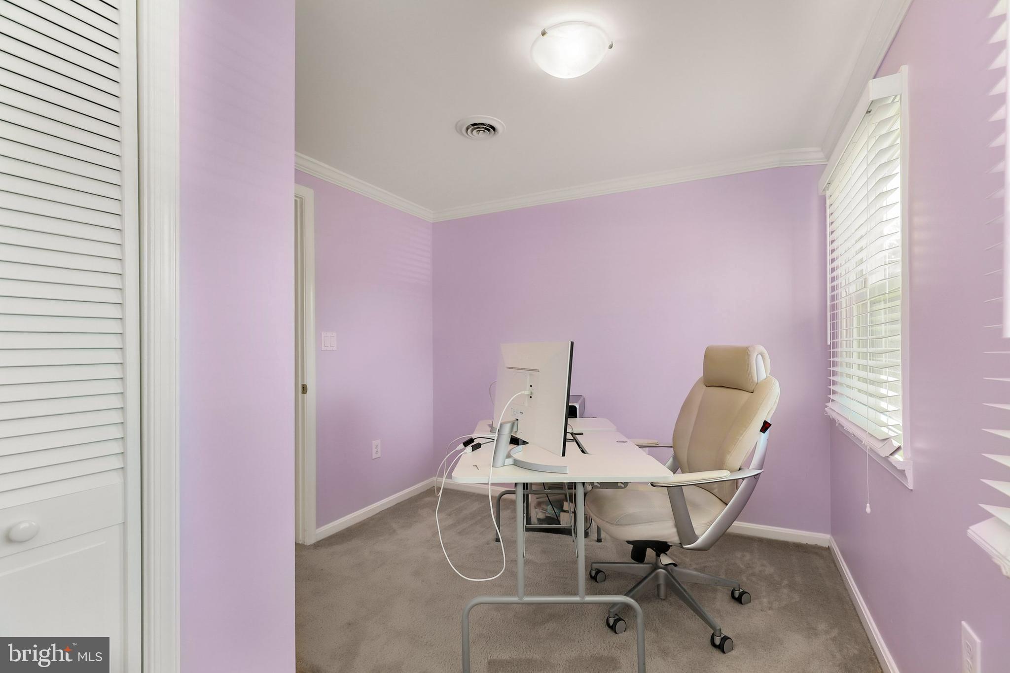 9515 Riley Road Silver Spring, MD 20910 - Photo 30 of 43 a view of a workspace with furniture and window