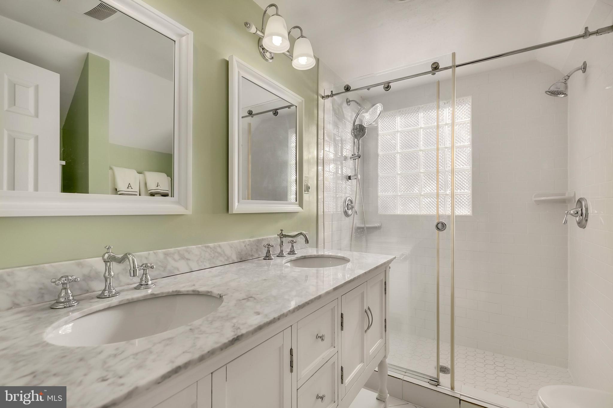 9515 Riley Road Silver Spring, MD 20910 - Photo 32 of 43 a bathroom with a granite countertop sink mirror and double