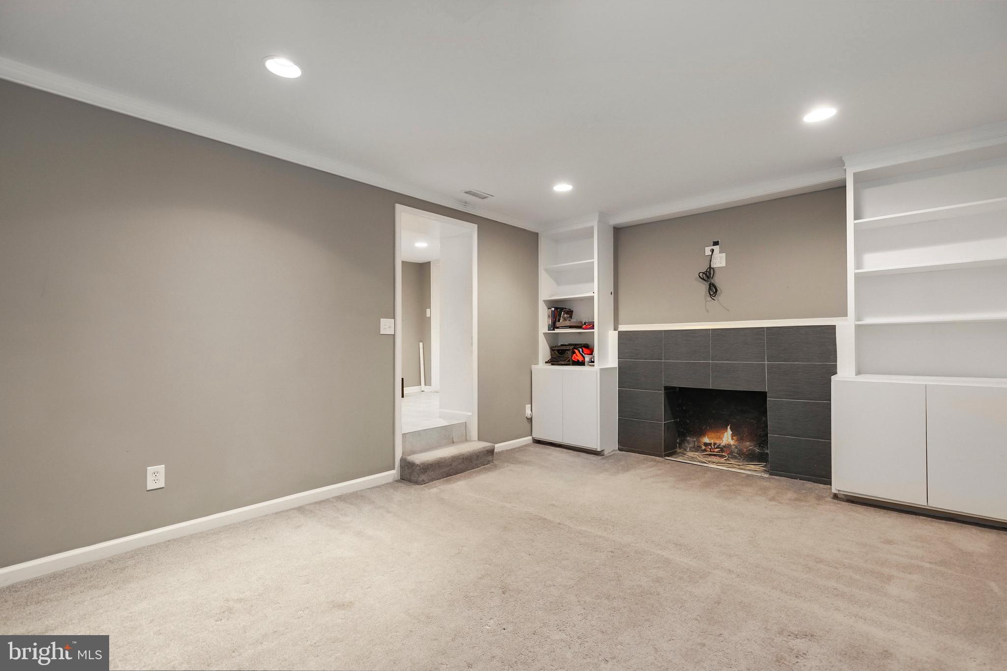 9515 Riley Road Silver Spring, MD 20910 - Photo 34 of 43 a view of an empty room with a fireplace