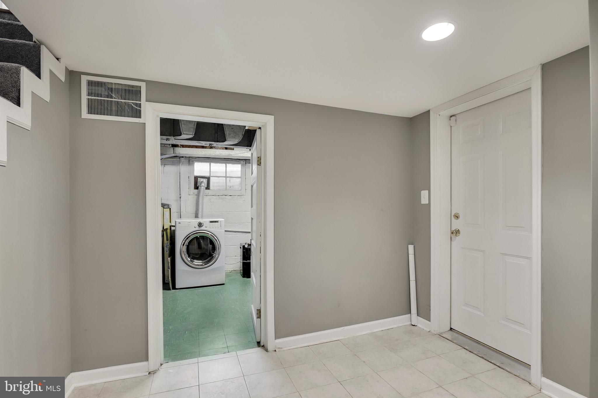 9515 Riley Road Silver Spring, MD 20910 - Photo 37 of 43 a view of a storage & utility room with washer and dryer