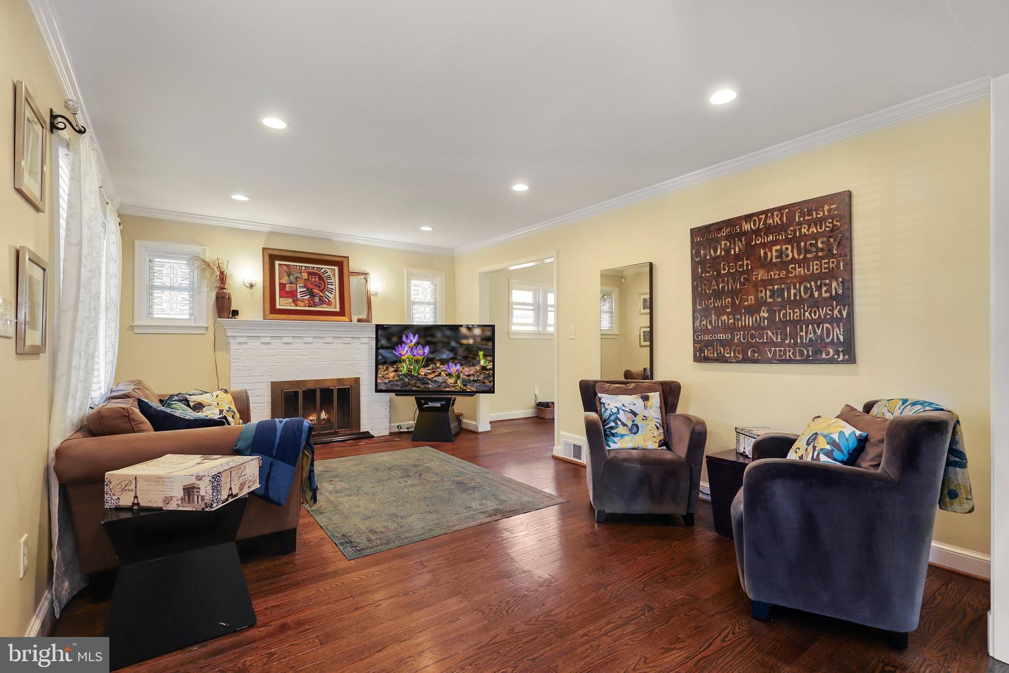 9515 Riley Road Silver Spring, MD 20910 - Photo 5 of 43 a living room with fireplace furniture and a flat screen tv