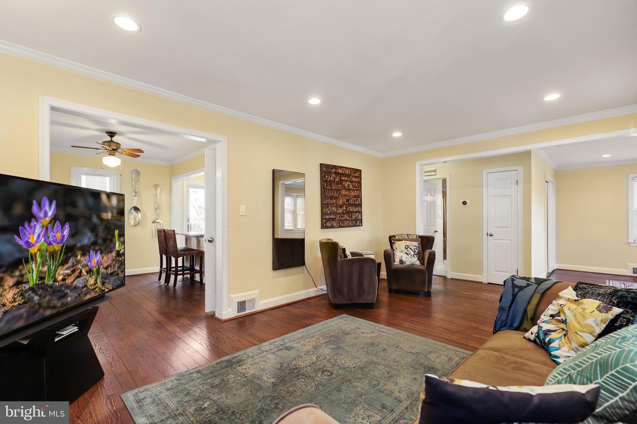 9515 Riley Road Silver Spring, MD 20910 - Photo 7 of 43 a living room with furniture flat screen tv and wooden floor