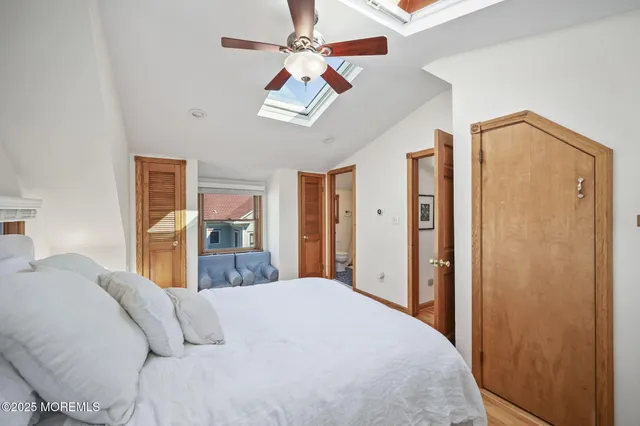 a bed room with a bed and a chandelier