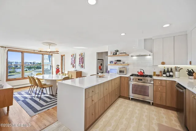 a kitchen that has a lot of cabinets in it and appliances