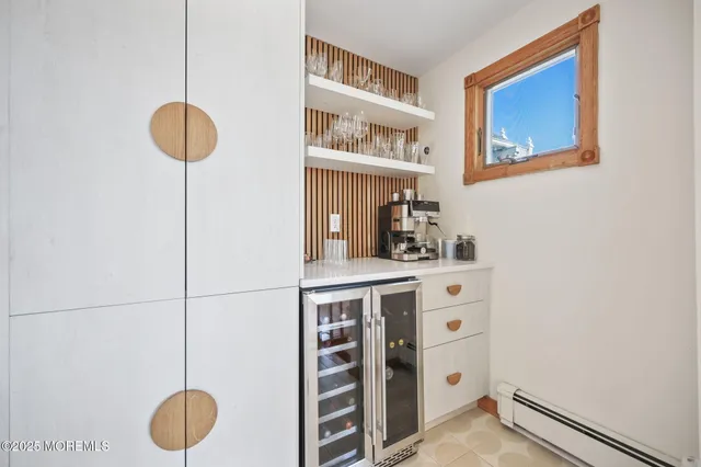 a room with a walk in closet and a chair