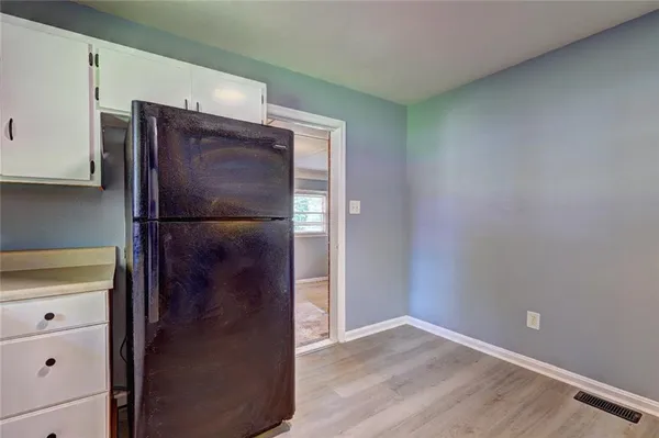 a refrigerator freezer sitting in a kitchen