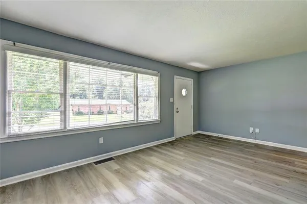 a view of an empty room with a window