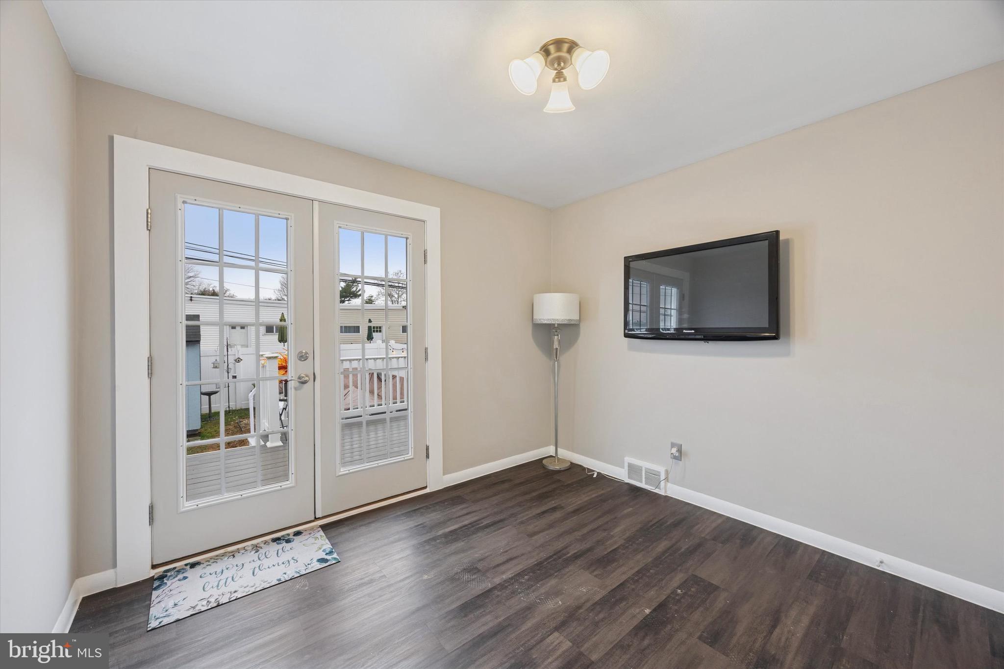 213 Hoffman Road Ridley Park, PA 19078 - Photo 11 of 29 a view of an empty room with wooden floor and a window