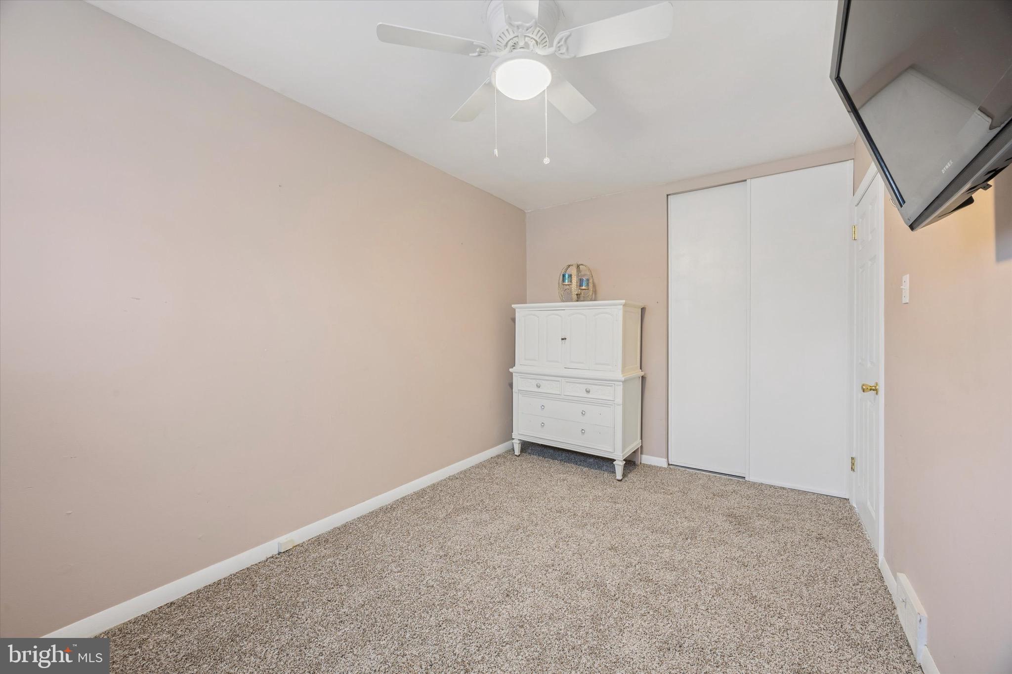 213 Hoffman Road Ridley Park, PA 19078 - Photo 13 of 29 an empty room with a fan and a ceiling fan