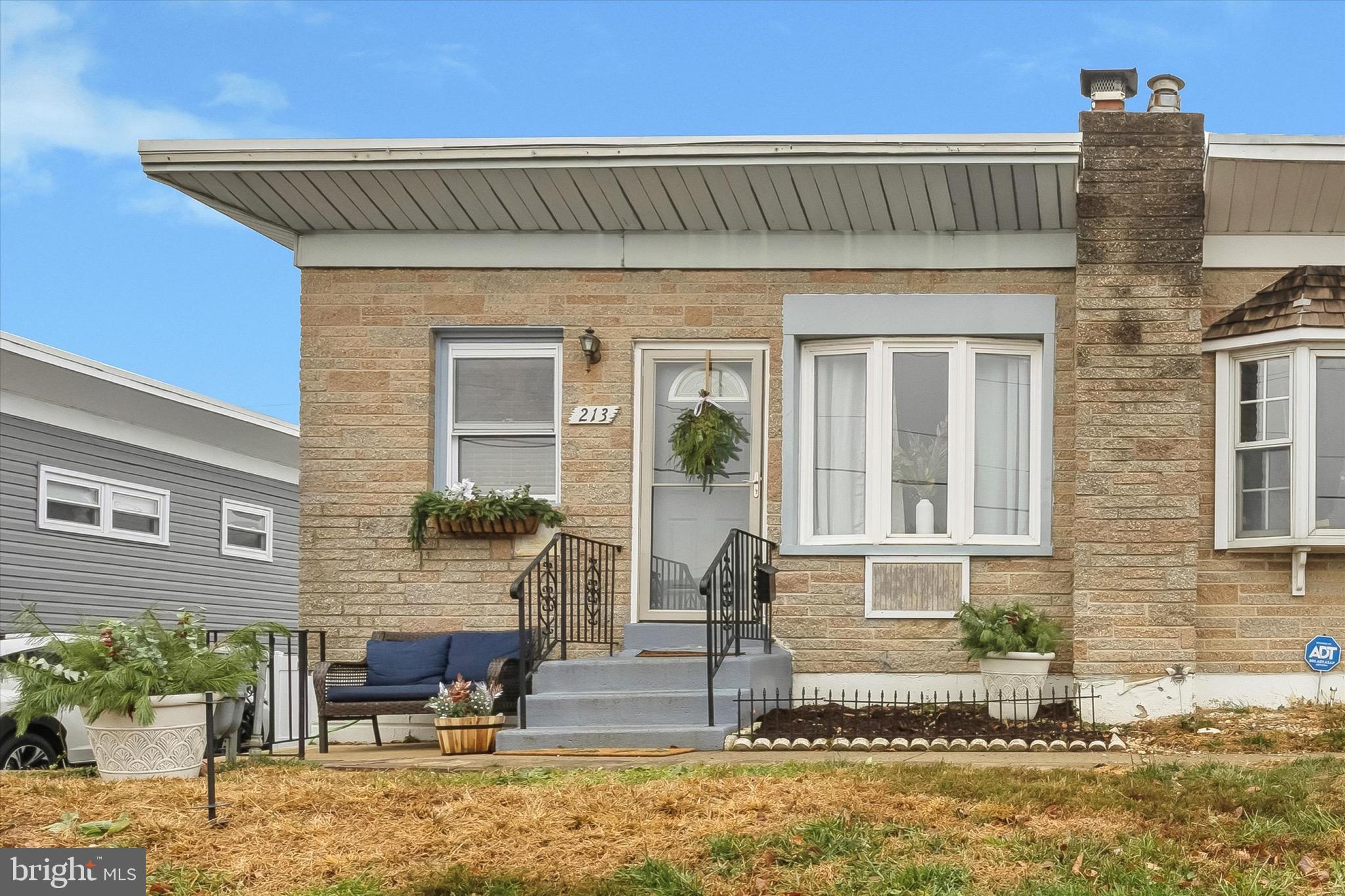 213 Hoffman Road Ridley Park, PA 19078 - Photo 2 of 29 a front view of a house with garden