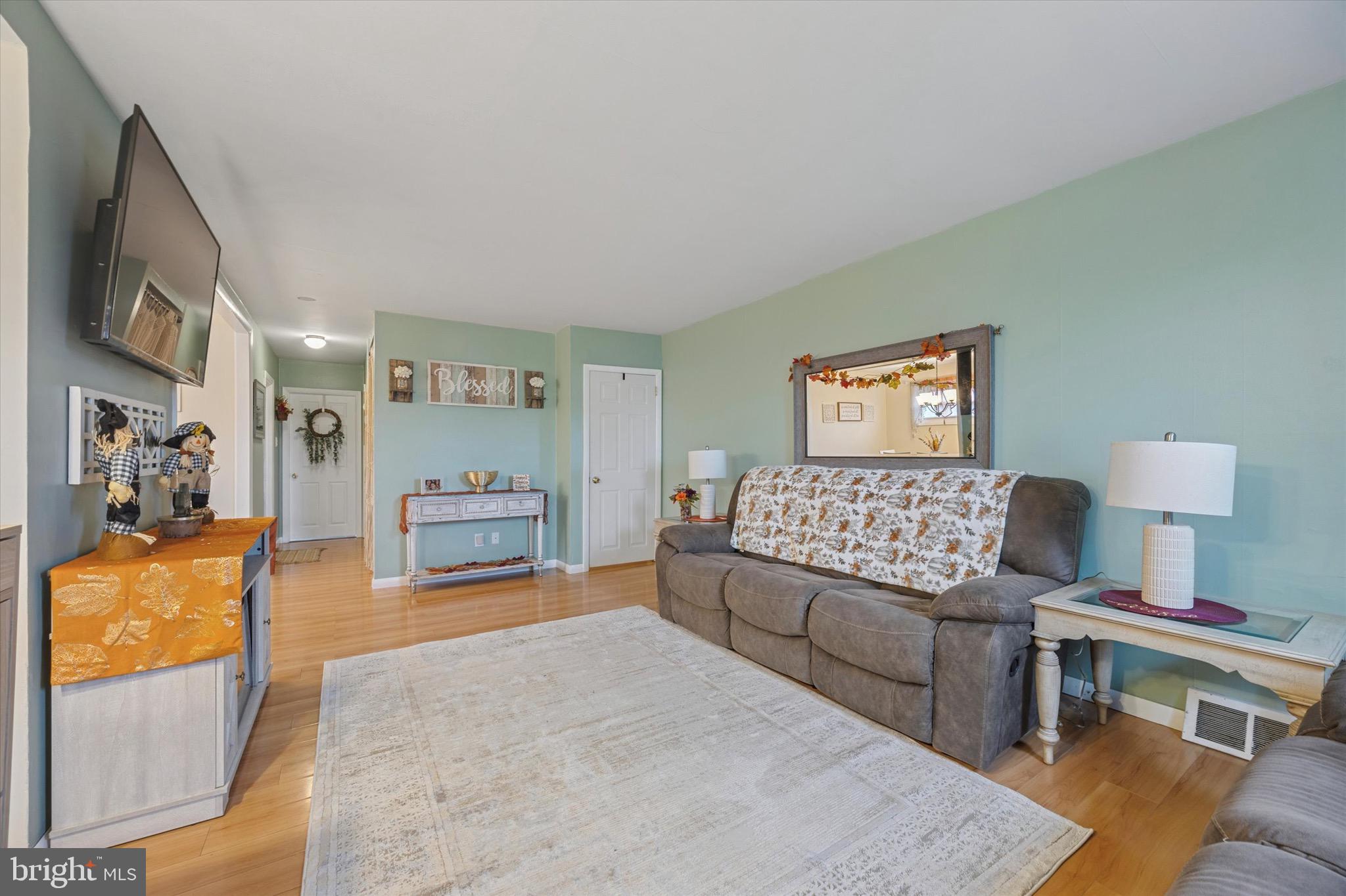 213 Hoffman Road Ridley Park, PA 19078 - Photo 4 of 29 a living room with furniture and a flat screen tv