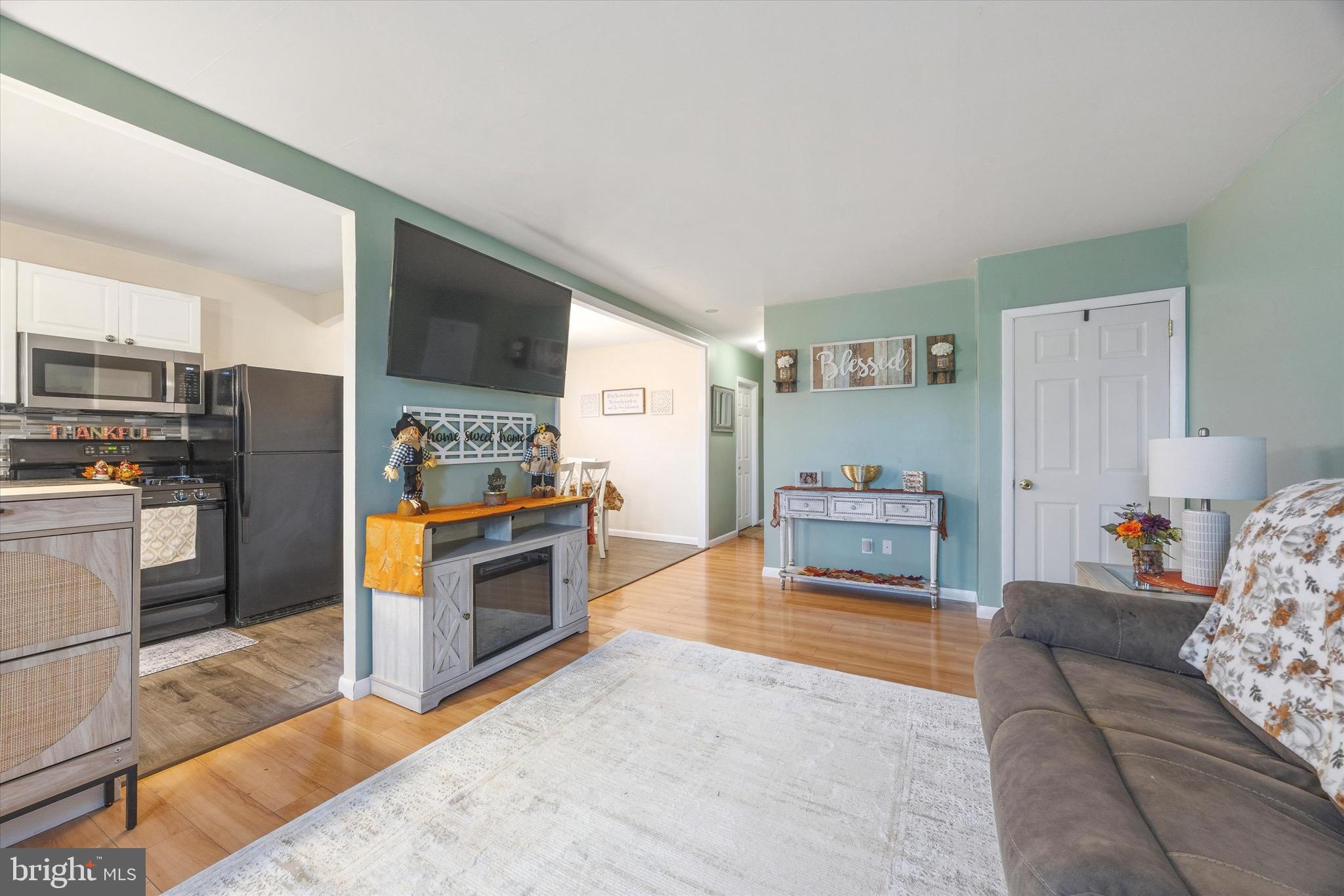 213 Hoffman Road Ridley Park, PA 19078 - Photo 28 of 29 a living room with furniture and a kitchen view