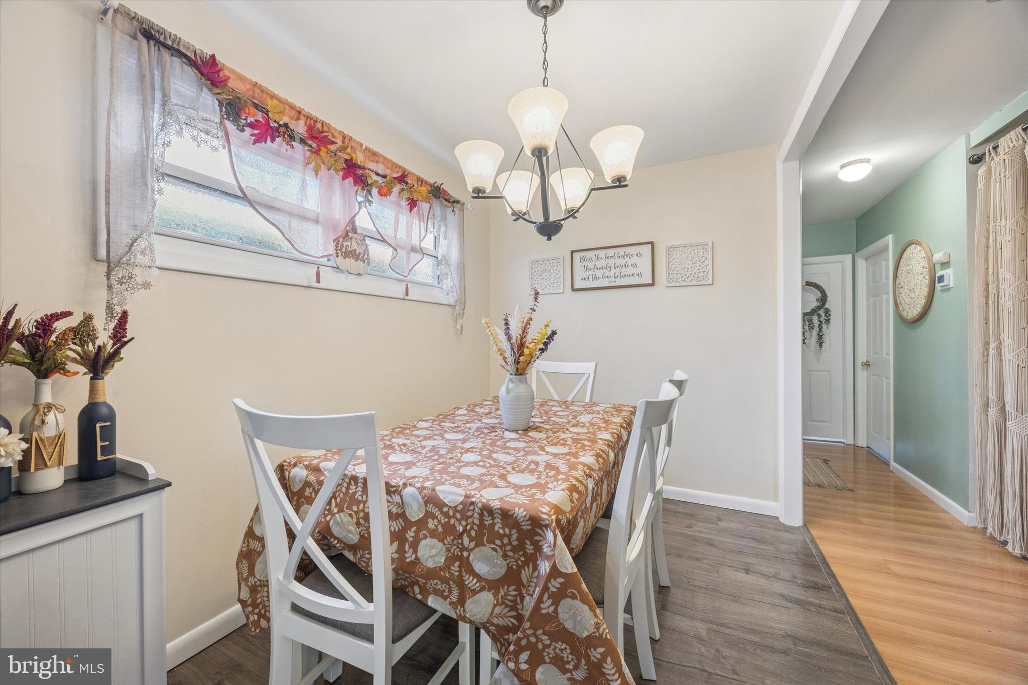 213 Hoffman Road Ridley Park, PA 19078 - Photo 8 of 29 a view of a dining room with furniture and wooden floor