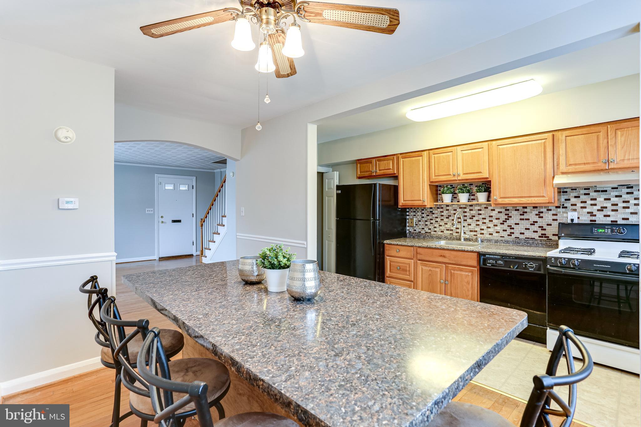 8301 Ridgely Oak Road Baltimore, MD 21234 - Photo 10 of 25 Open dining room and kitchen