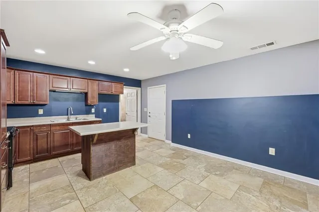 a view of balcony with wooden floor and fence