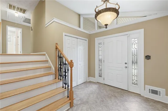 a view of a kitchen with granite countertop a stove and a wooden floors