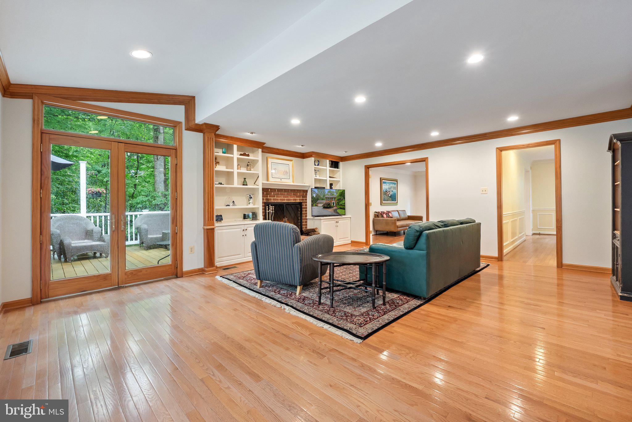 11100 Burywood Lane Reston, VA 20194 - Photo 12 of 42 a living room with furniture a large window with kitchen view