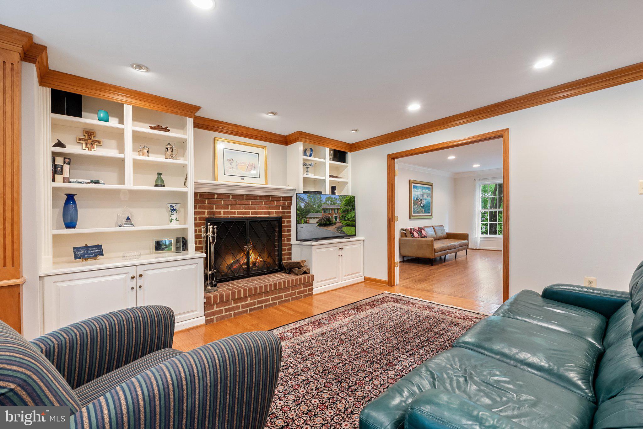 11100 Burywood Lane Reston, VA 20194 - Photo 13 of 42 a living room with furniture or couch and a fireplace