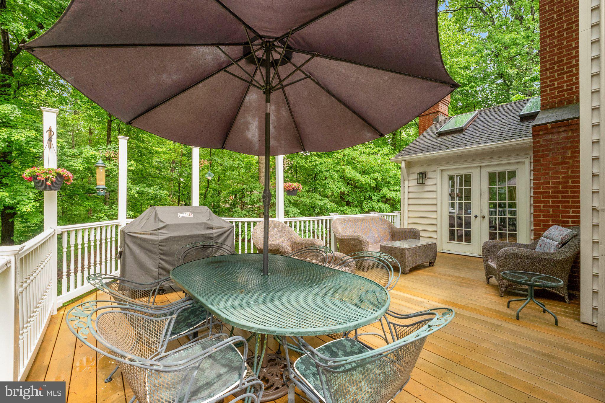 11100 Burywood Lane Reston, VA 20194 - Photo 15 of 42 a patio with a patio table and chairs