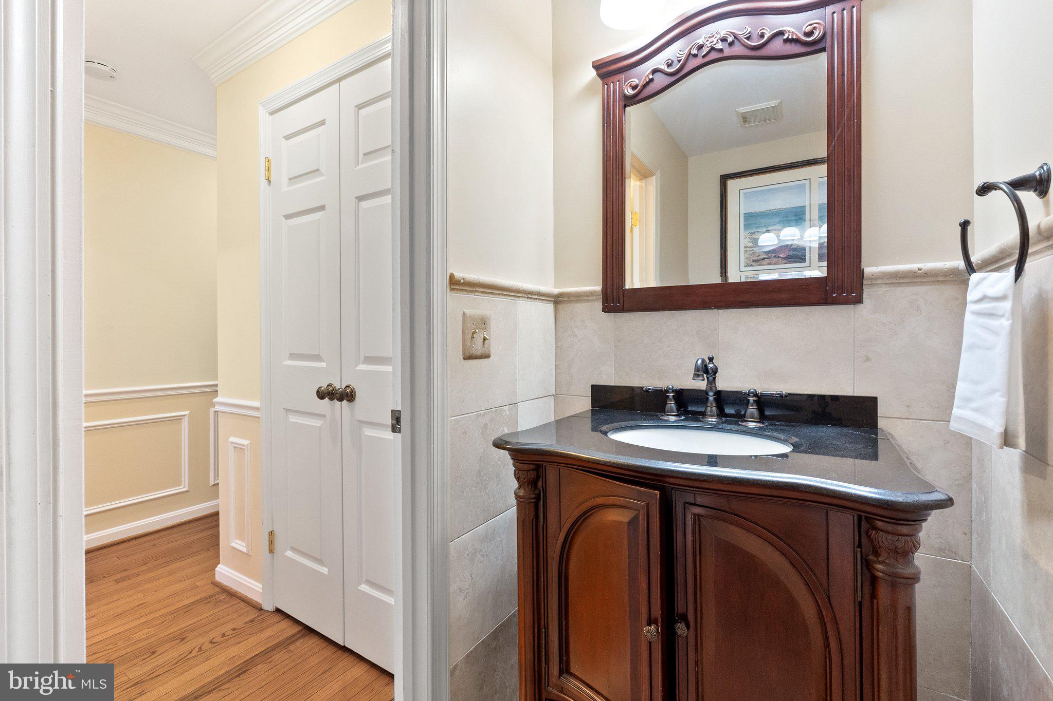 11100 Burywood Lane Reston, VA 20194 - Photo 20 of 42 a bathroom with a sink and a mirror