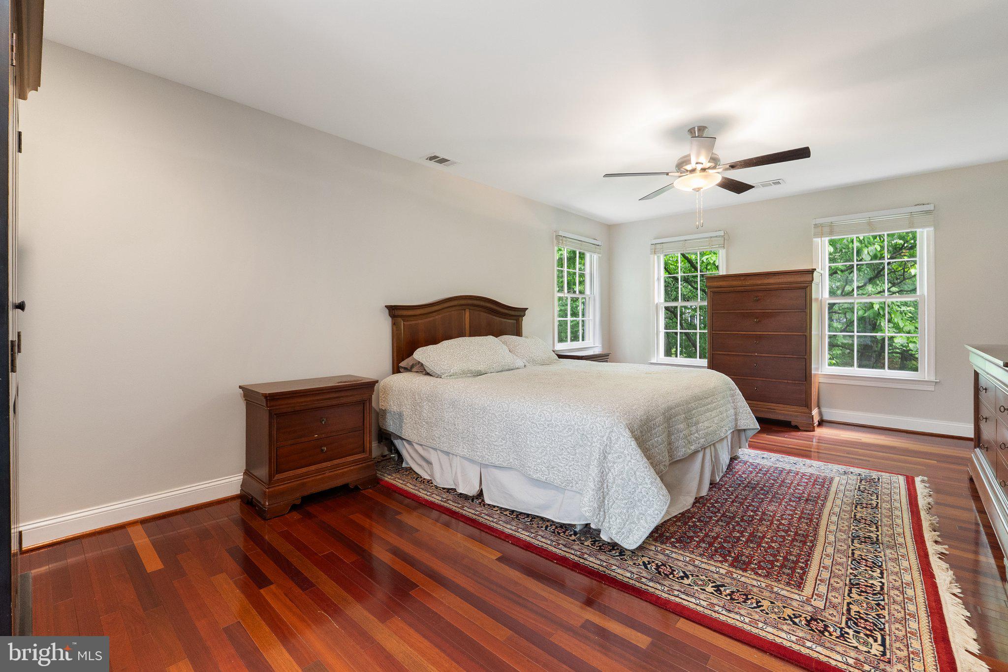 11100 Burywood Lane Reston, VA 20194 - Photo 22 of 42 a bedroom with a bed dresser and a window