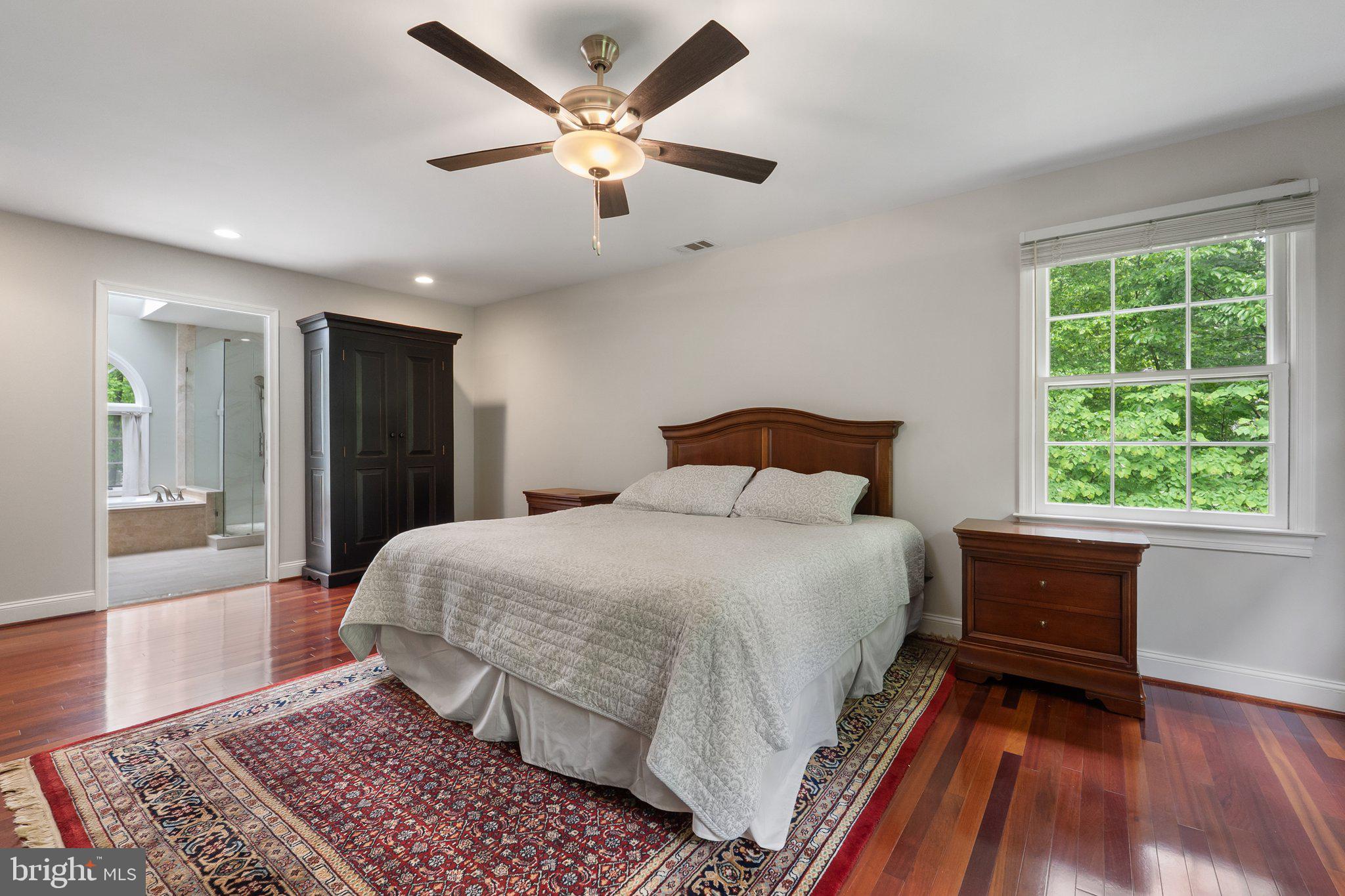 11100 Burywood Lane Reston, VA 20194 - Photo 23 of 42 a bedroom with a large bed and a window