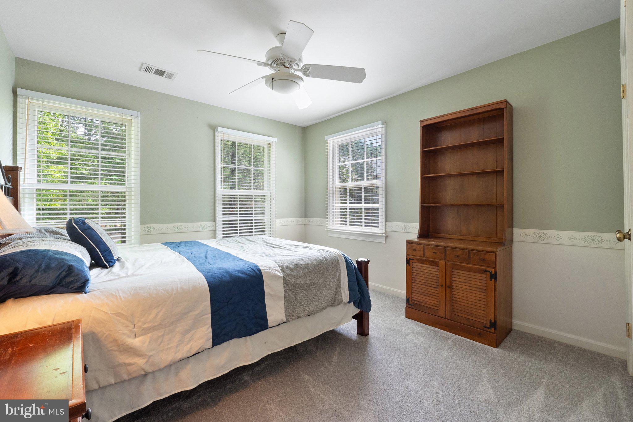 11100 Burywood Lane Reston, VA 20194 - Photo 27 of 42 a bedroom with a bed and a window