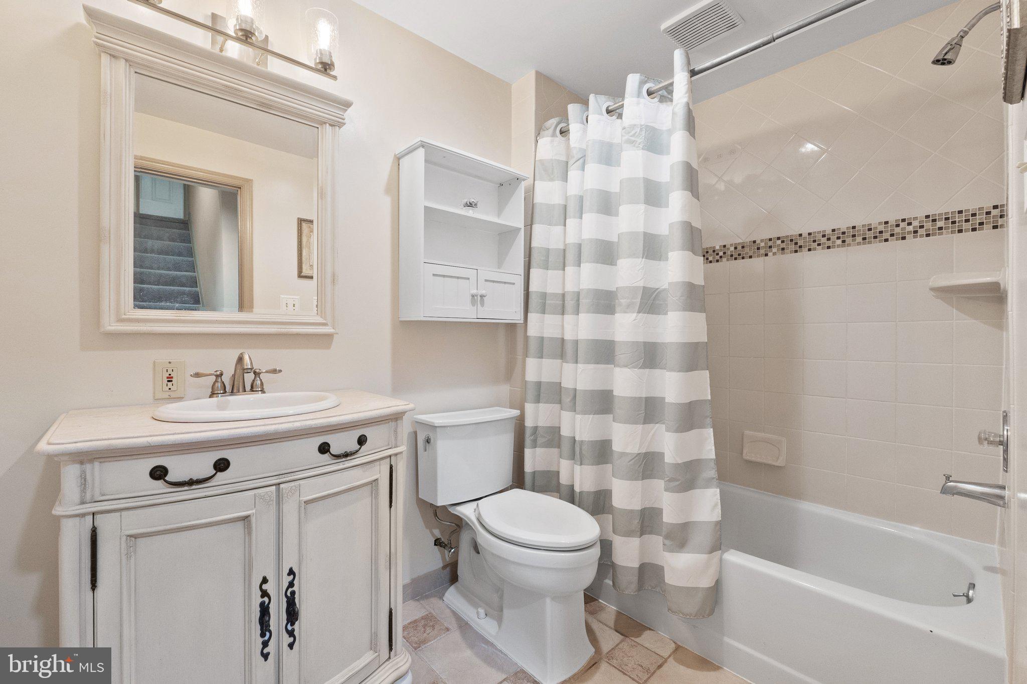11100 Burywood Lane Reston, VA 20194 - Photo 30 of 42 a bathroom with a sink toilet a shower and vanity