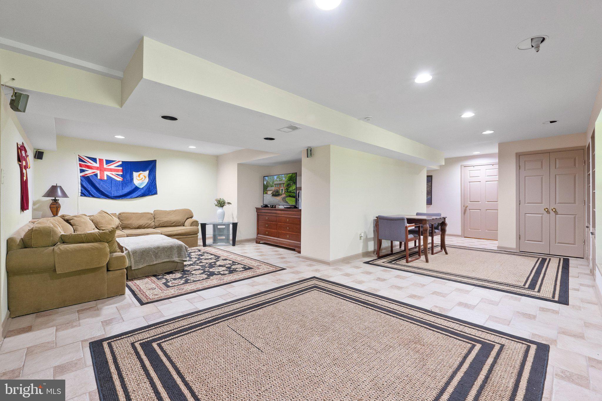 11100 Burywood Lane Reston, VA 20194 - Photo 32 of 42 a living room with furniture and a rug