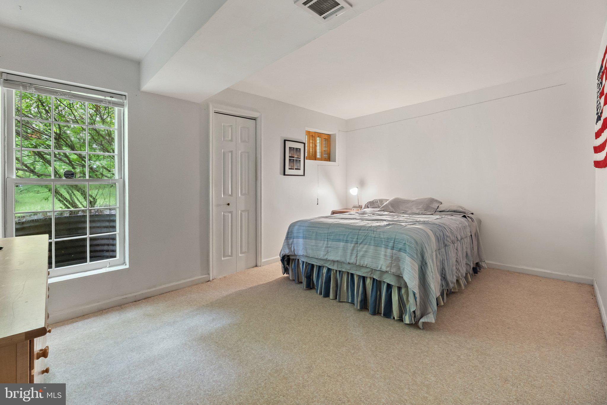 11100 Burywood Lane Reston, VA 20194 - Photo 33 of 42 a bedroom with a bed and window