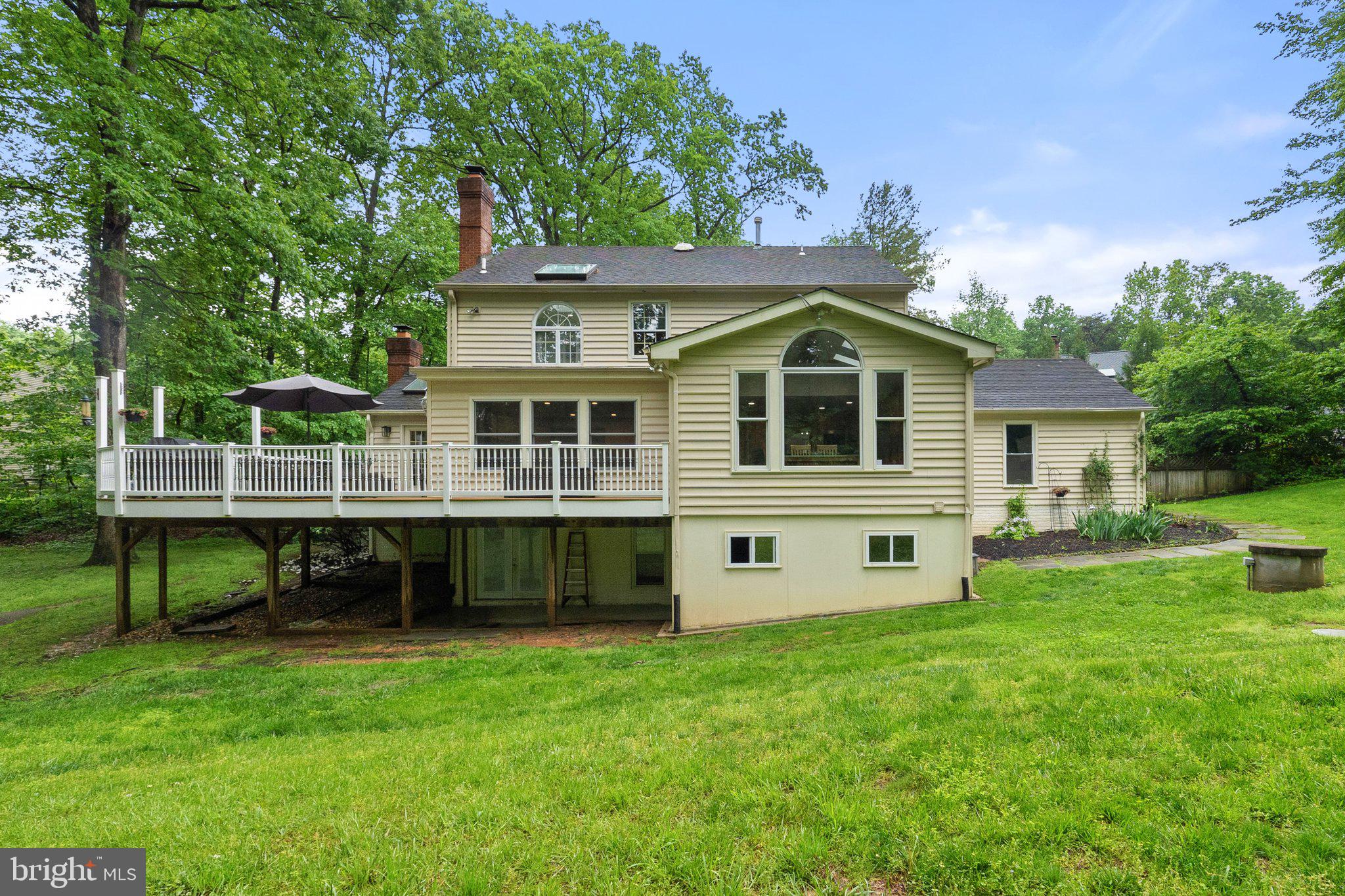 11100 Burywood Lane Reston, VA 20194 - Photo 35 of 42 a view of a house with a yard and sitting area