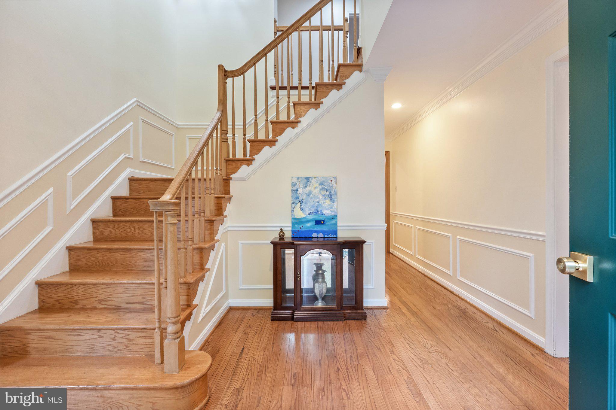 11100 Burywood Lane Reston, VA 20194 - Photo 4 of 42 a view of entryway and hall with wooden floor