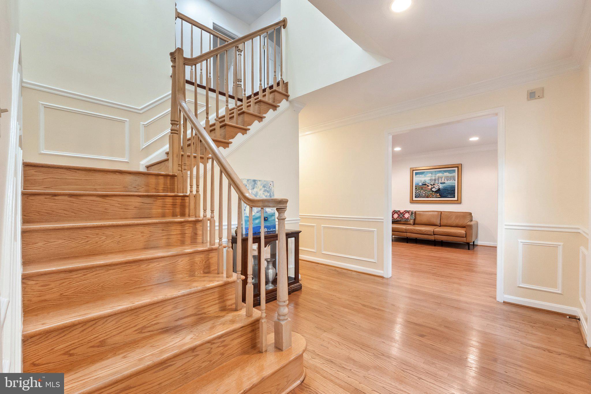 11100 Burywood Lane Reston, VA 20194 - Photo 5 of 42 a view of entryway and hall with wooden floor