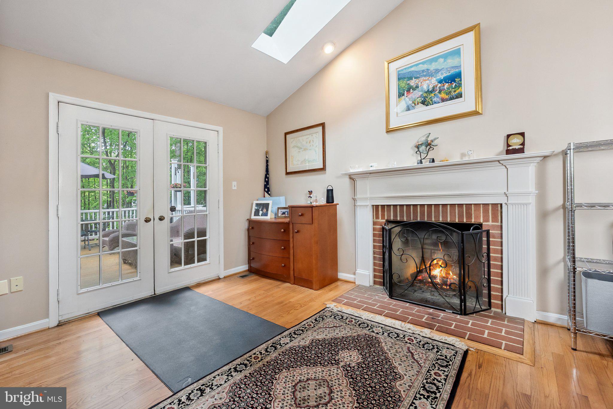 11100 Burywood Lane Reston, VA 20194 - Photo 7 of 42 a living room with furniture and a fireplace